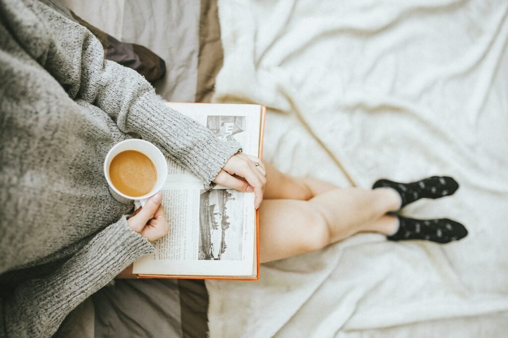 Woman reading with a coffee